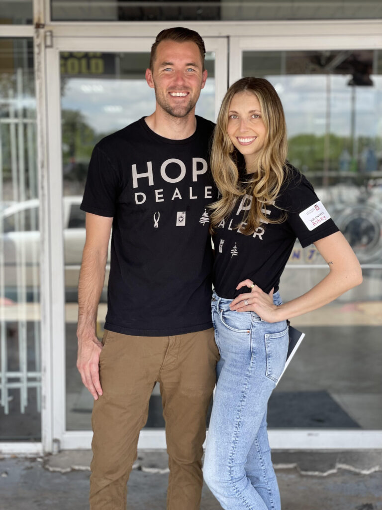 Brad and Ashley Stuver pose together and smile at the camera. 