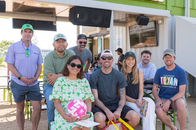 A group of people posing for the camera, including Brad and Ashley Stuver